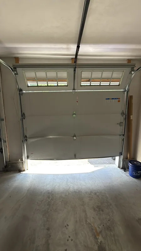 Damaged panels by Green Garage Doors