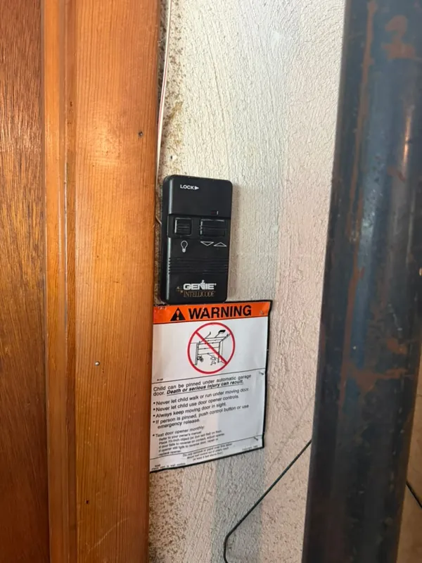Old wall button by Green Garage Doors