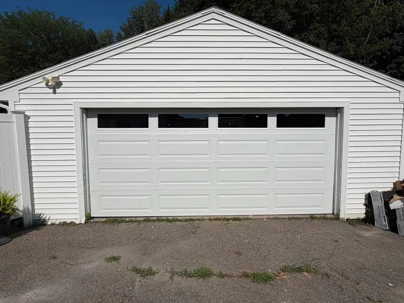White double door with windows by Green Garage Doors